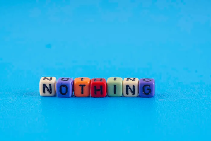 Colorful letter blocks spelling NOTHING on a blue background, symbolizing kids questions that stump parents.