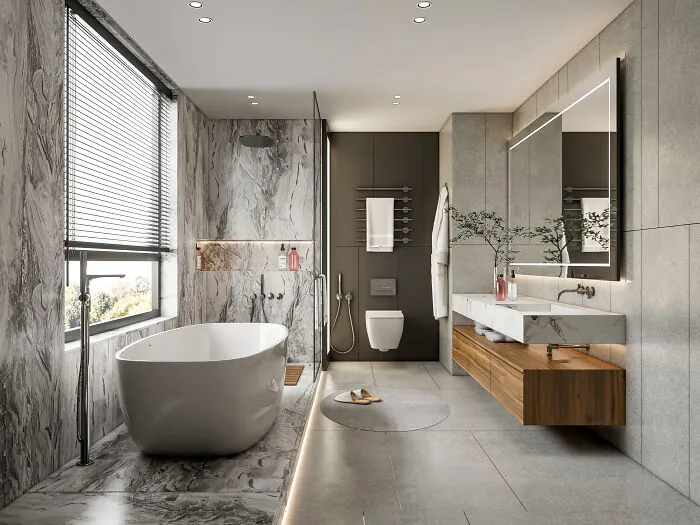 A modern, luxurious bathroom with a freestanding tub, marble walls, and sleek vanity, highlighting guest house etiquette.