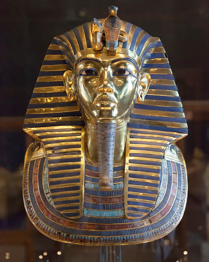 A close-up of King Tutankhamun's golden burial mask, an artifact surrounded by ancient mysteries.