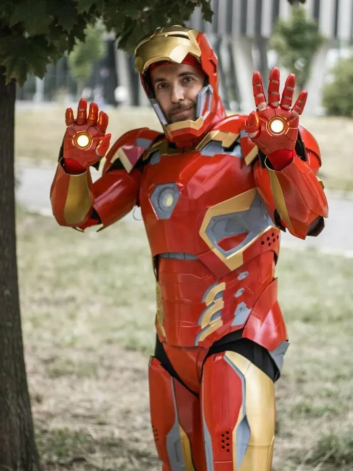 Person in a detailed Iron Man suit, a stunning example of 3D printing creations.