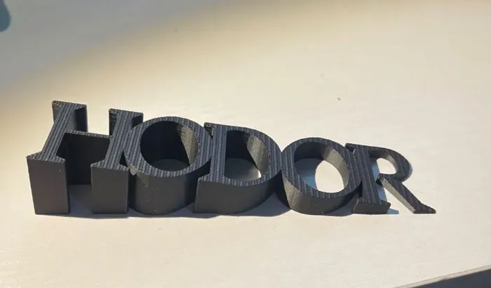A 3D printing creation spelling HODOR, demonstrating amazing 3D printing.