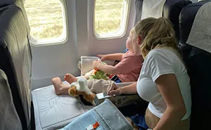Entitled Mom Demands Plane Seatmate Hands Over Their Free Coke To Unruly Son, Gets A Reality Check
