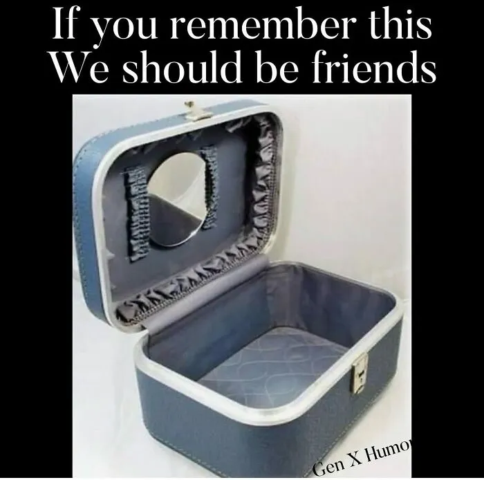 An open, empty blue vanity case with a small mirror inside. This Gen X meme is a nostalgic memory for many.