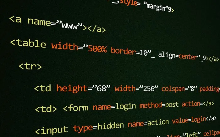 A close-up of computer code on a dark screen, showing lines of HTML with various tags and attributes, representing internet rabbit holes.