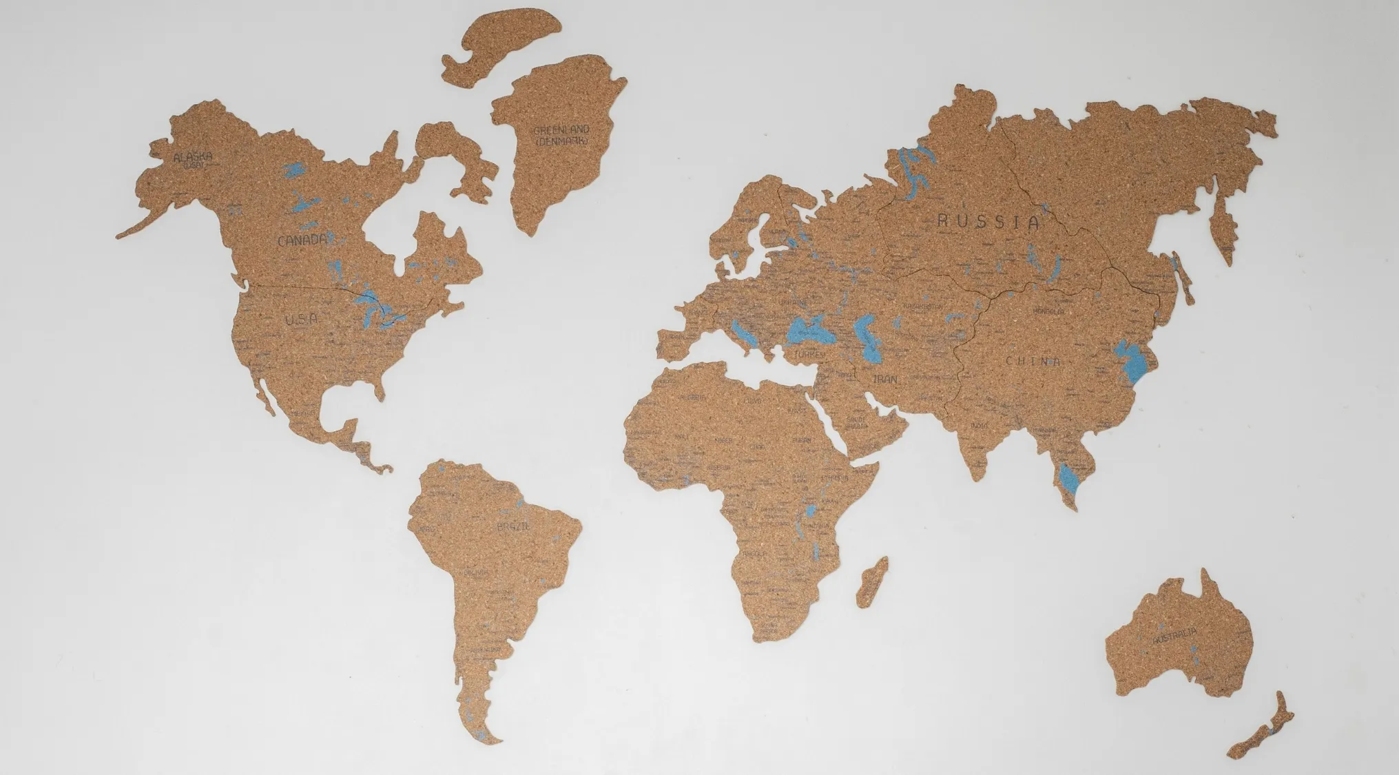 A cork map showing all continents, for general knowledge about Earth's largest continent.