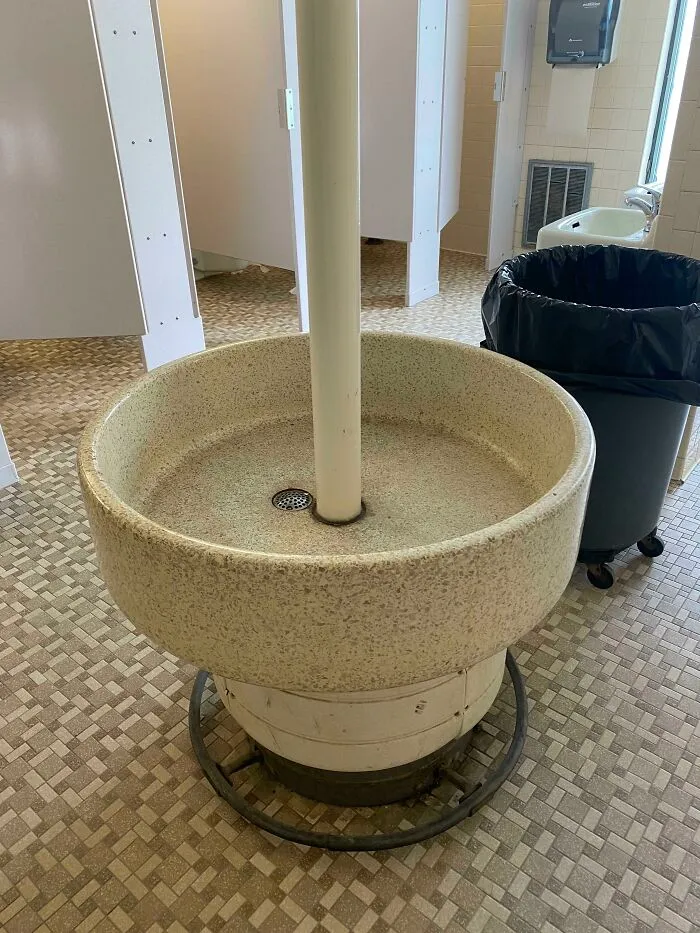 What Is This Big Round Well-Type Thing In The Middle Of The Women’s Restroom? It’s In An Older Bathroom And It Doesn’t Seem To Have Any Water Running To Or From It…just A Big Cylinder With A Drain In It