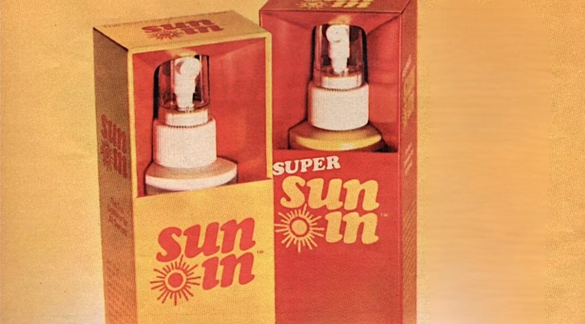 Two boxes of vintage Sun-In hair lightener, one red and one yellow, with white spray bottles visible.