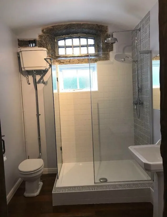My House Used To Be A Police Station And My Bathroom Is An Old Jail Cell, The Original Window Is Still In Place