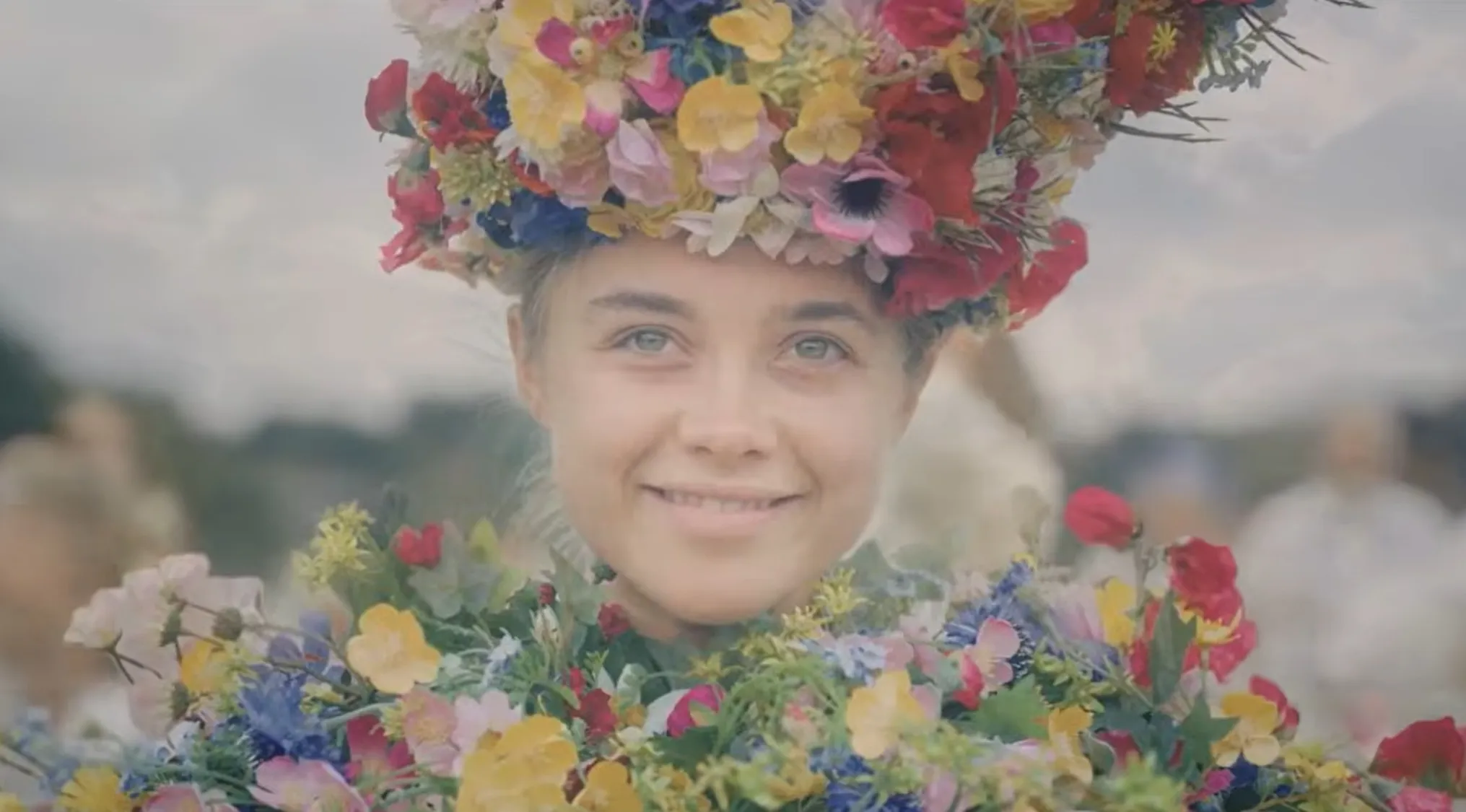 Woman smiling with a crown and dress made of flowers, a captivating final scene from a movie.