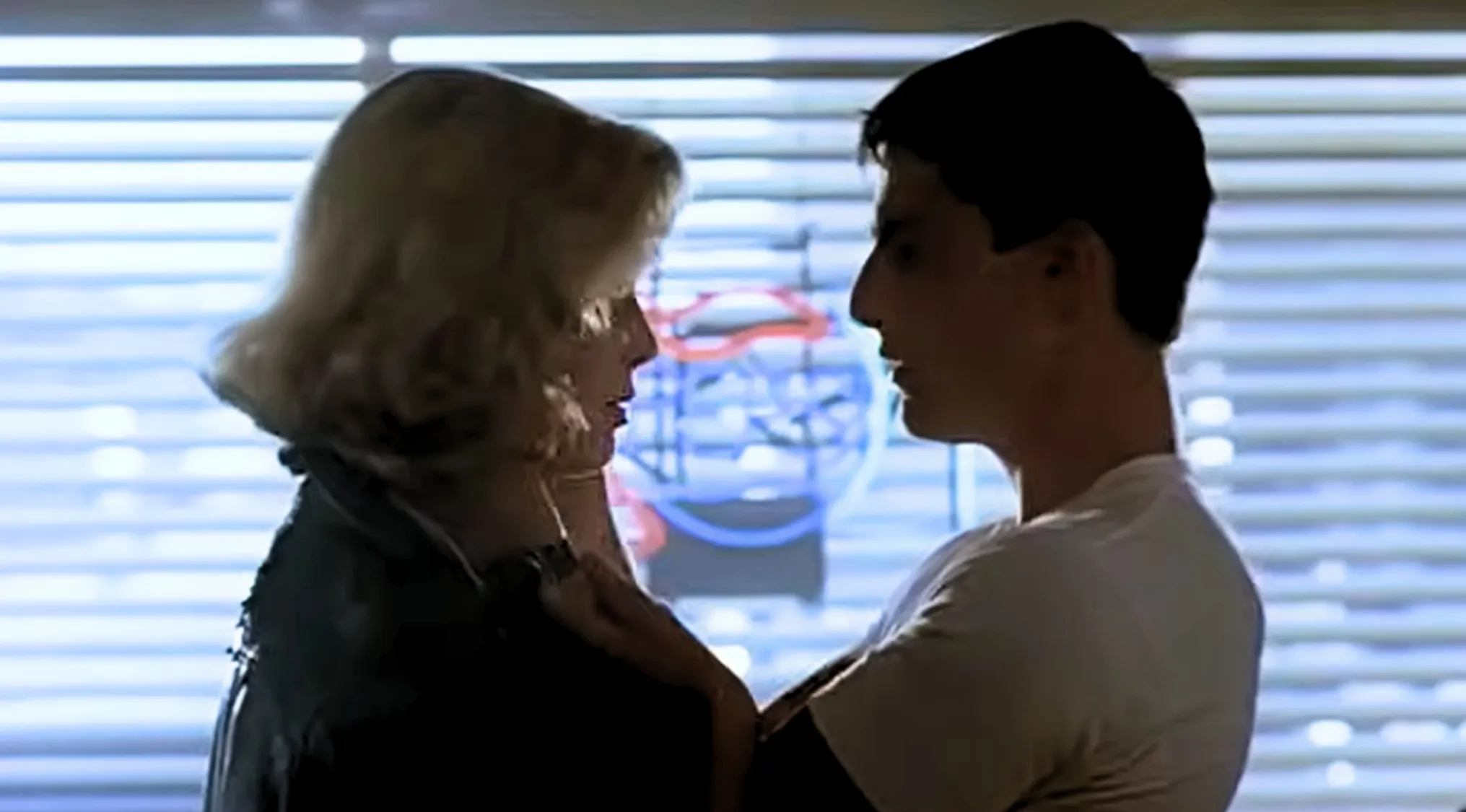 What movie rolls credits after this final scene of a couple intimately close, their faces nearly touching?