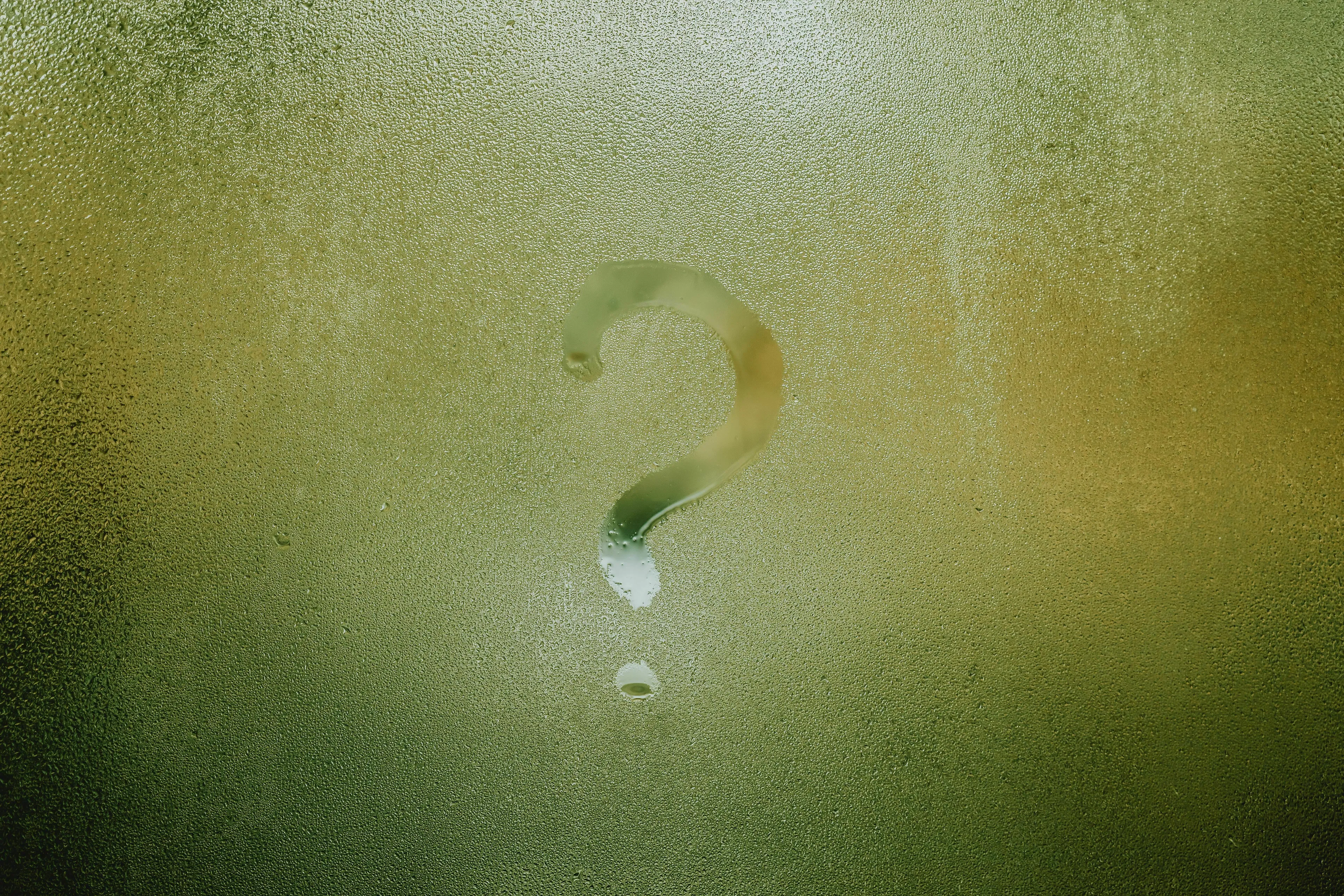 A question mark drawn on a steamy window for a mythological trickster quiz asking your real name or true form.