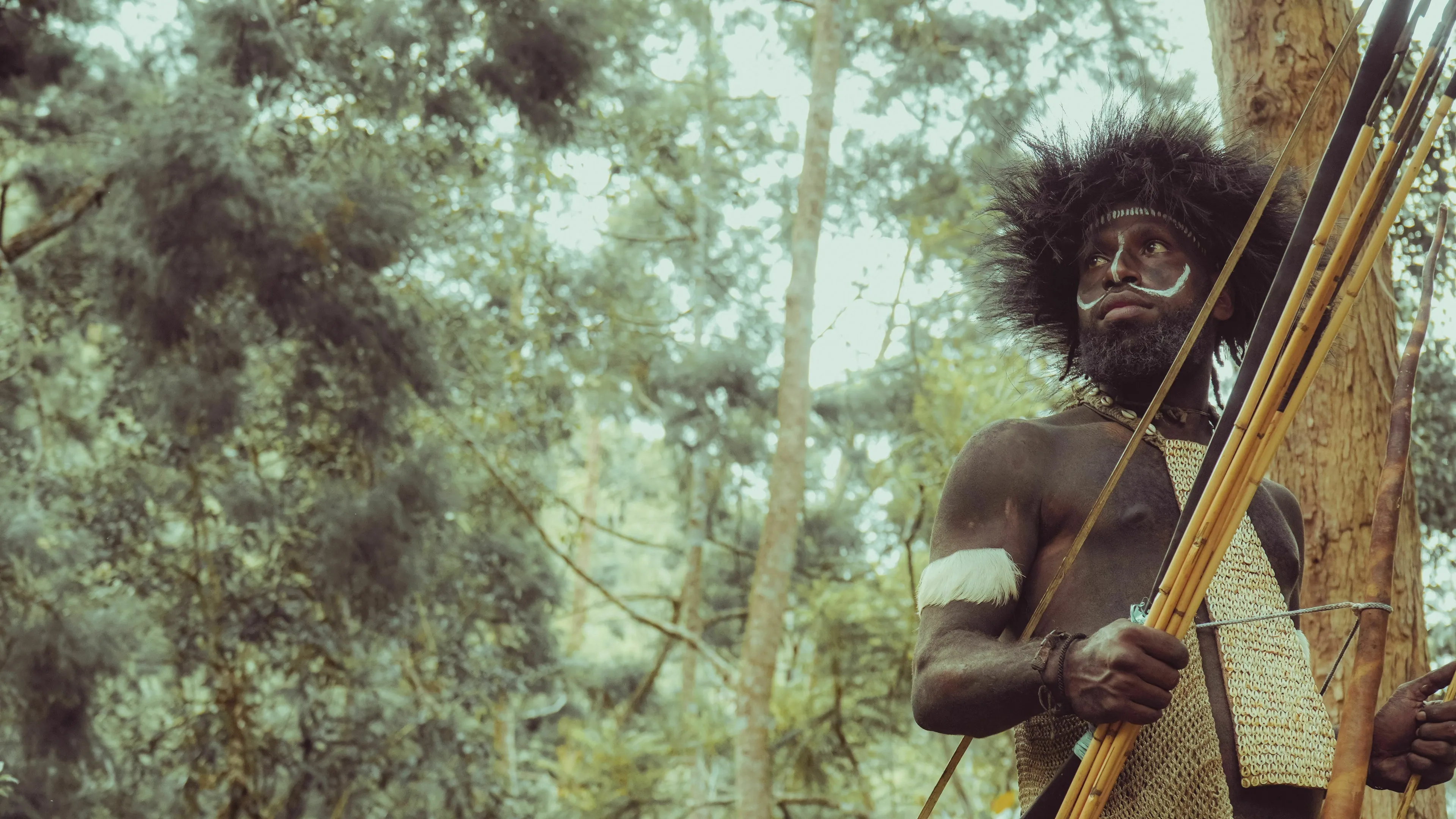 A mythological trickster, dressed as a hunter with a bow and arrows, contemplating a plan to escape.