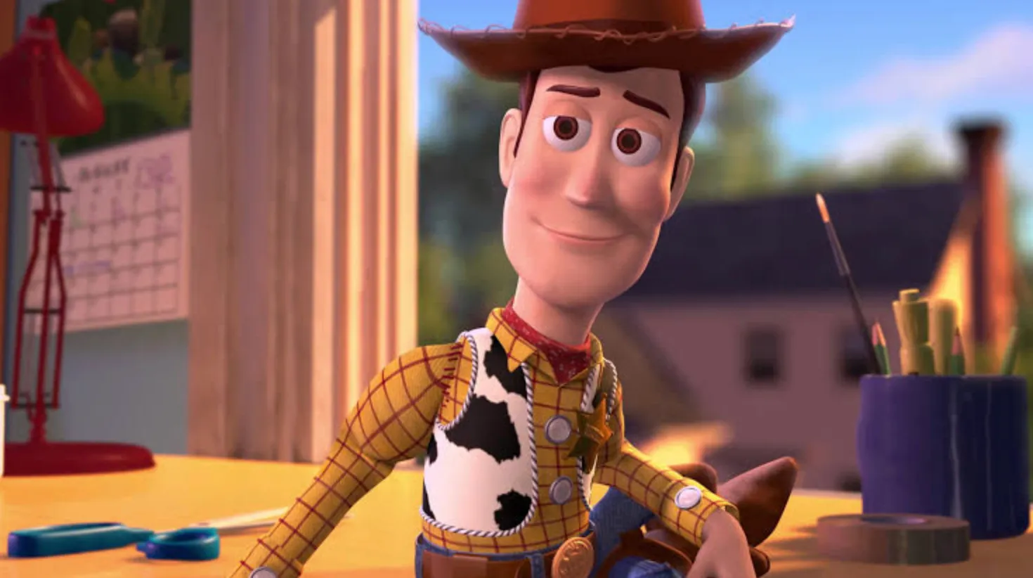 Sheriff Woody, the cowboy from Toy Story, smiling cheerfully in a room. A general knowledge quiz about Toy Story.