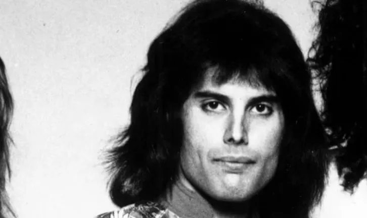 Freddie Mercury, lead singer of the rock band Queen, known for his powerful vocals and stage presence.