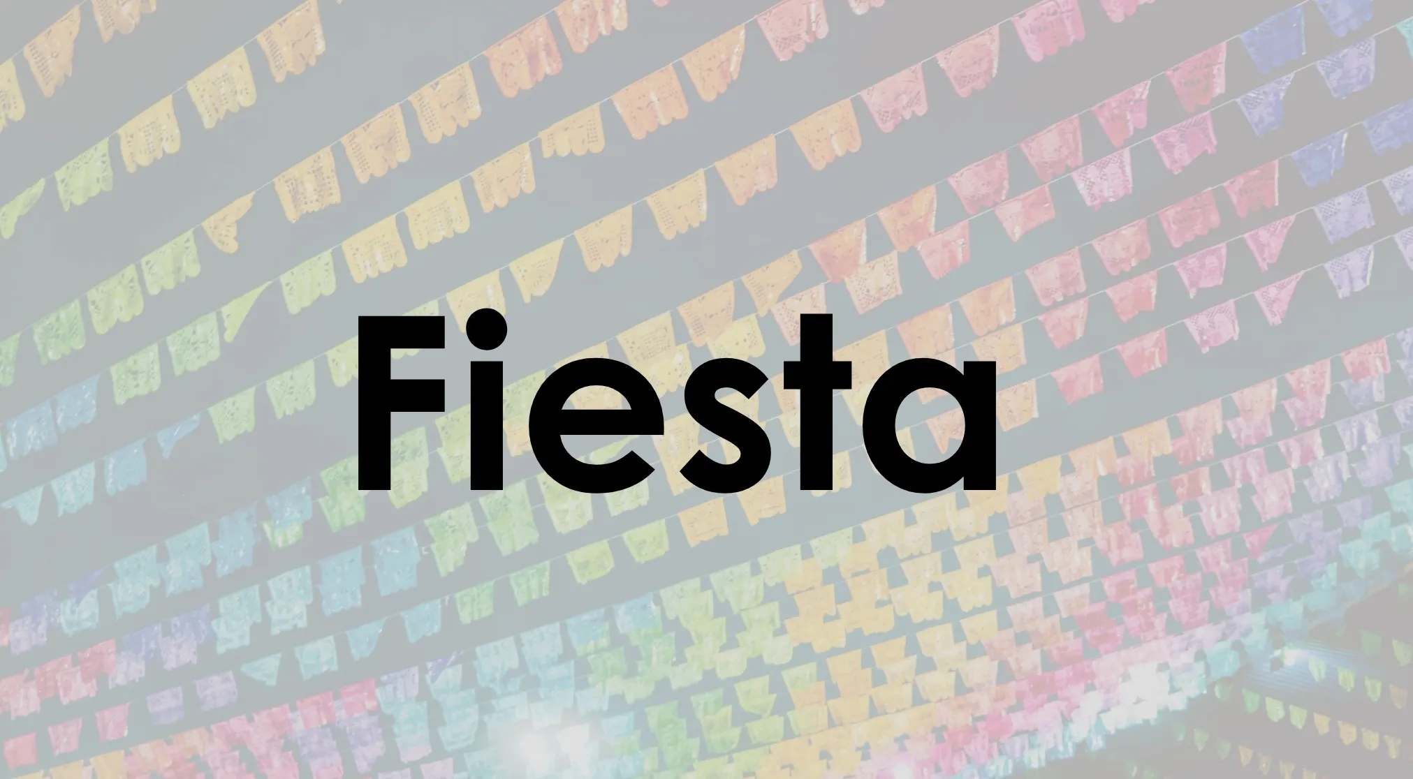Guess the book: The word "Fiesta" in black text against a blurred background of colorful banner decorations. Famous novel title.
