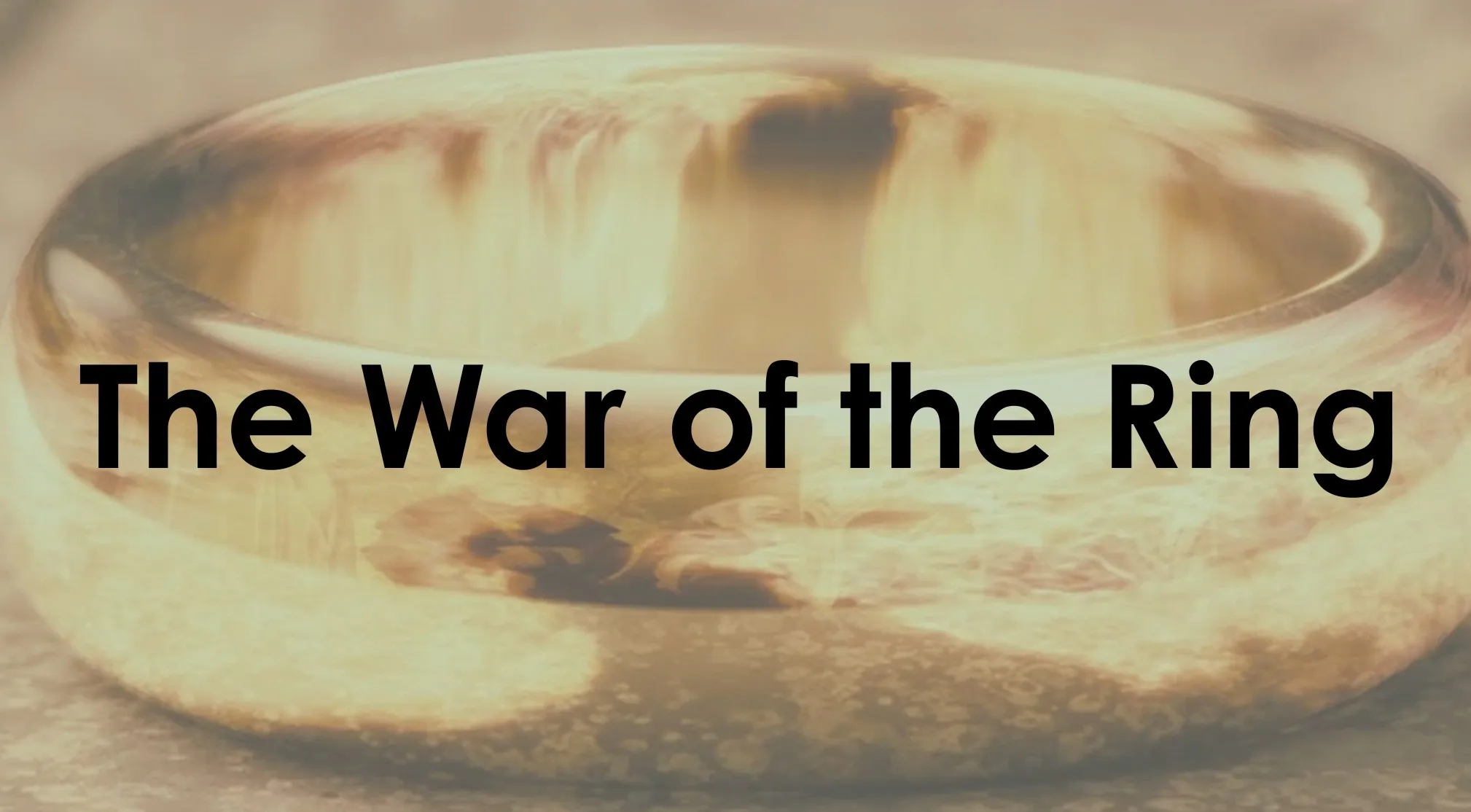 A close-up of a golden ring with the text The War of the Ring. Guess the book from the original title, famous fantasy novel.