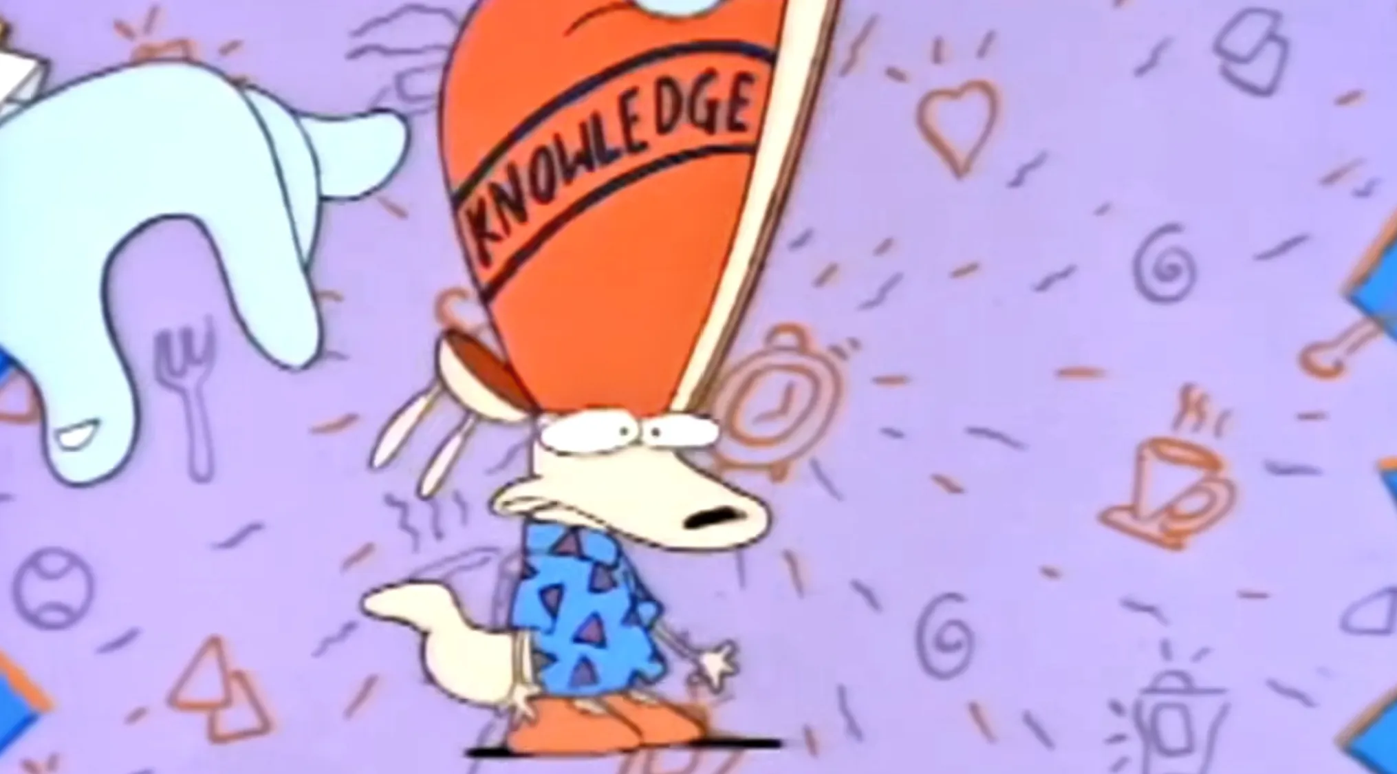 Saturday Morning Cartoons intro still of Rocko from Rocko's Modern Life with a large knowledge cap.