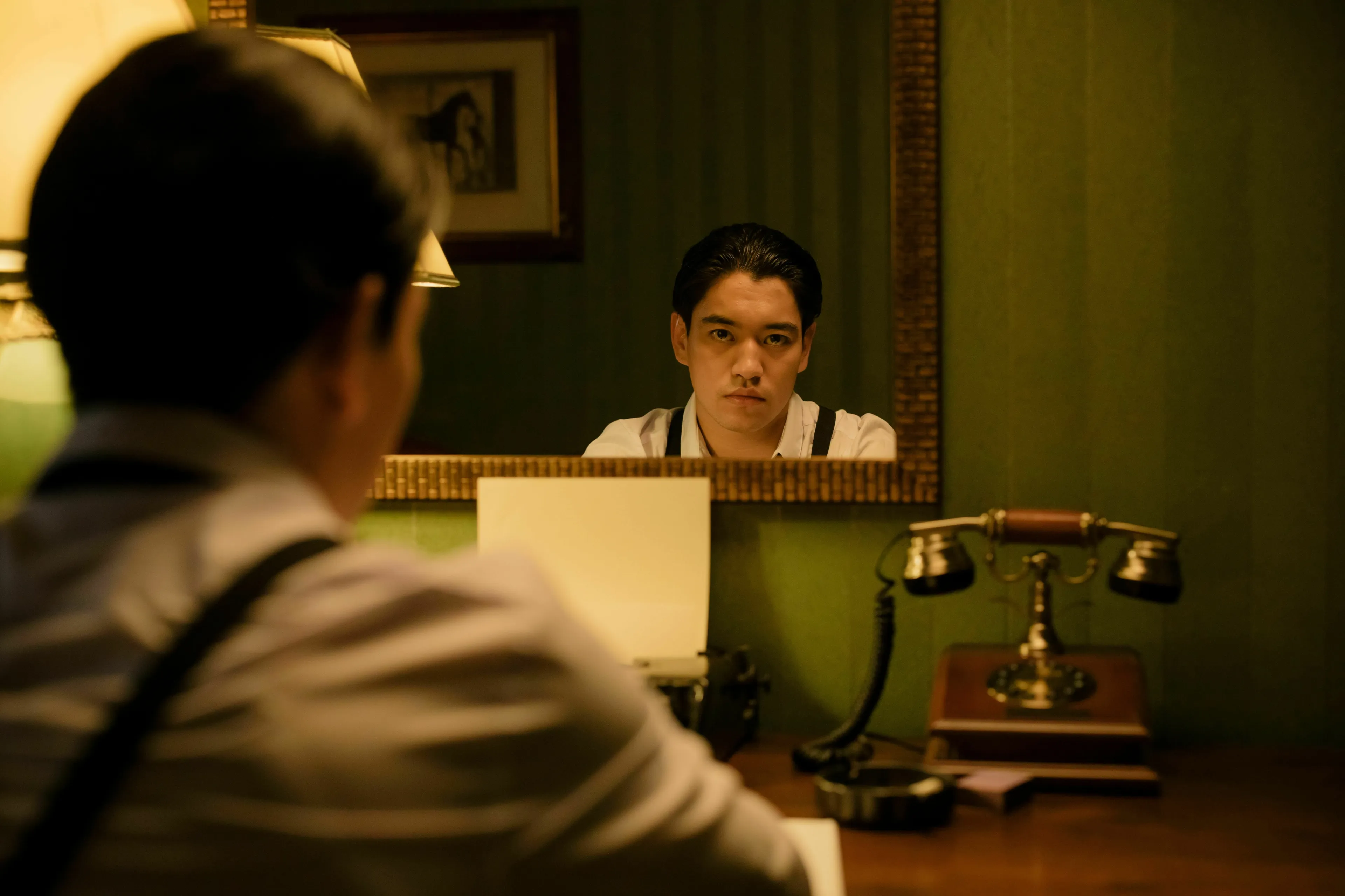 A person looking at their reflection in a mirror, experiencing déjà vu.