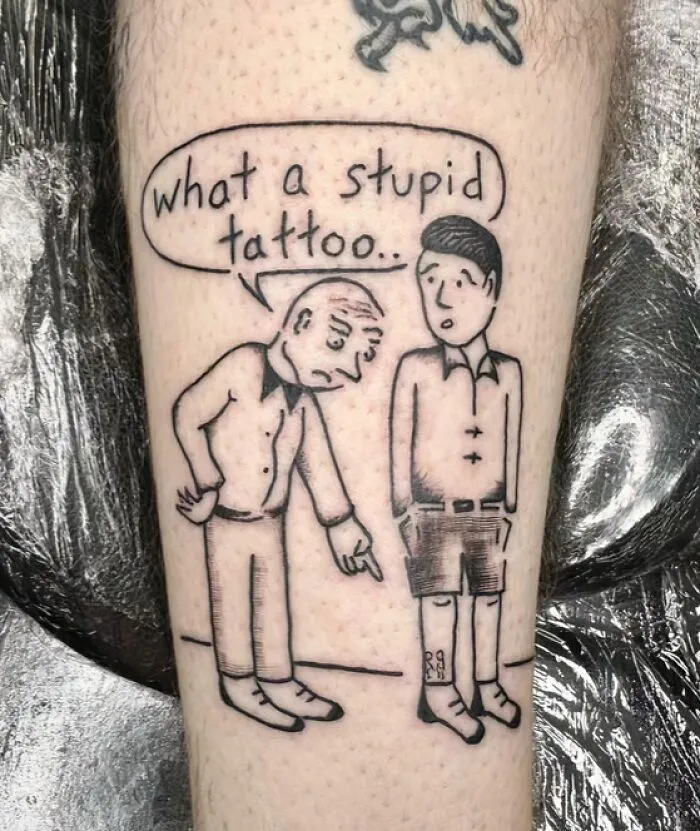 A comic-style leg tattoo of an older man pointing at a younger man, with a speech bubble saying 'what a stupid tattoo..', illustrating stunning tattoos.