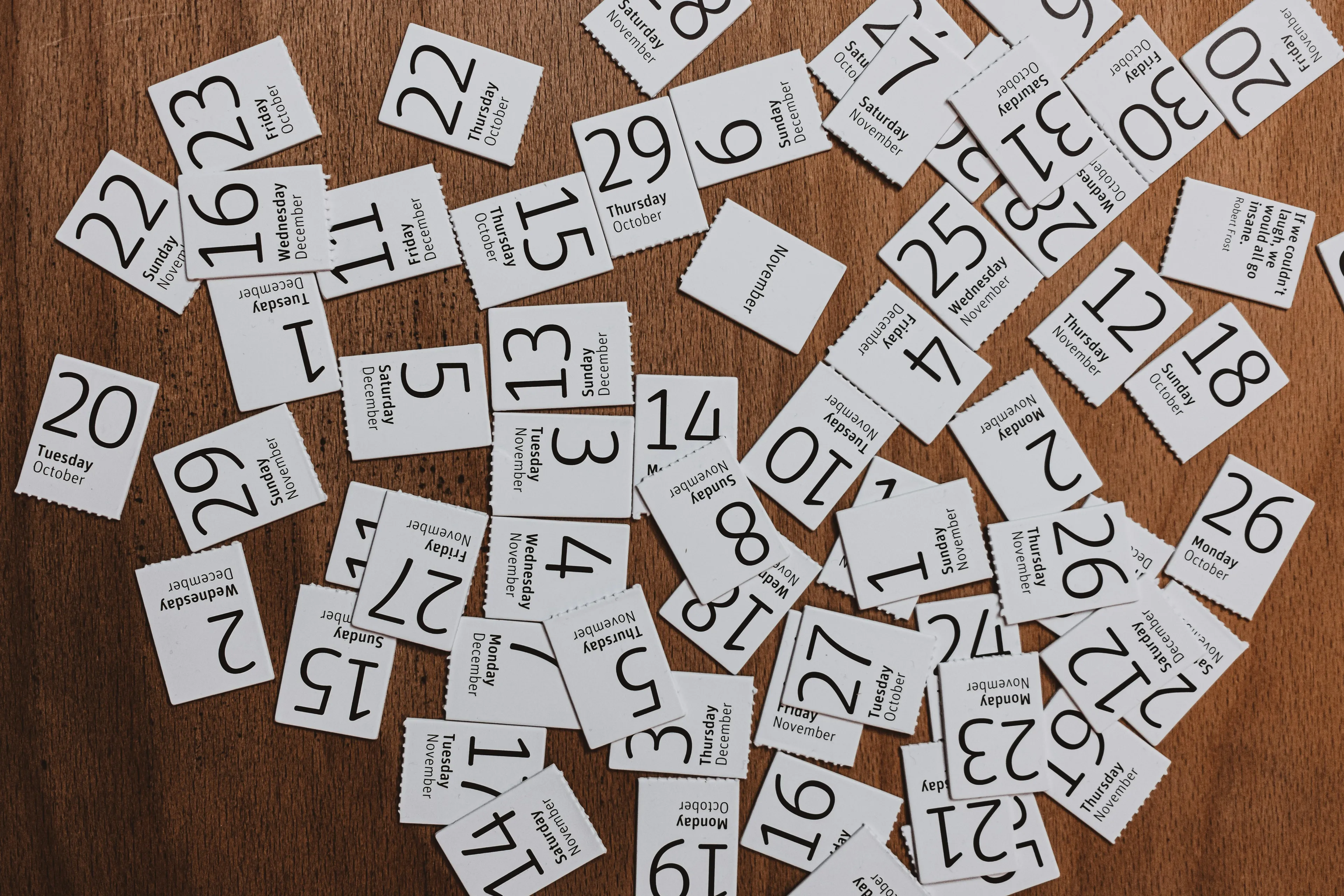 Scattered calendar pieces with various dates and months, representing a general knowledge question about months.