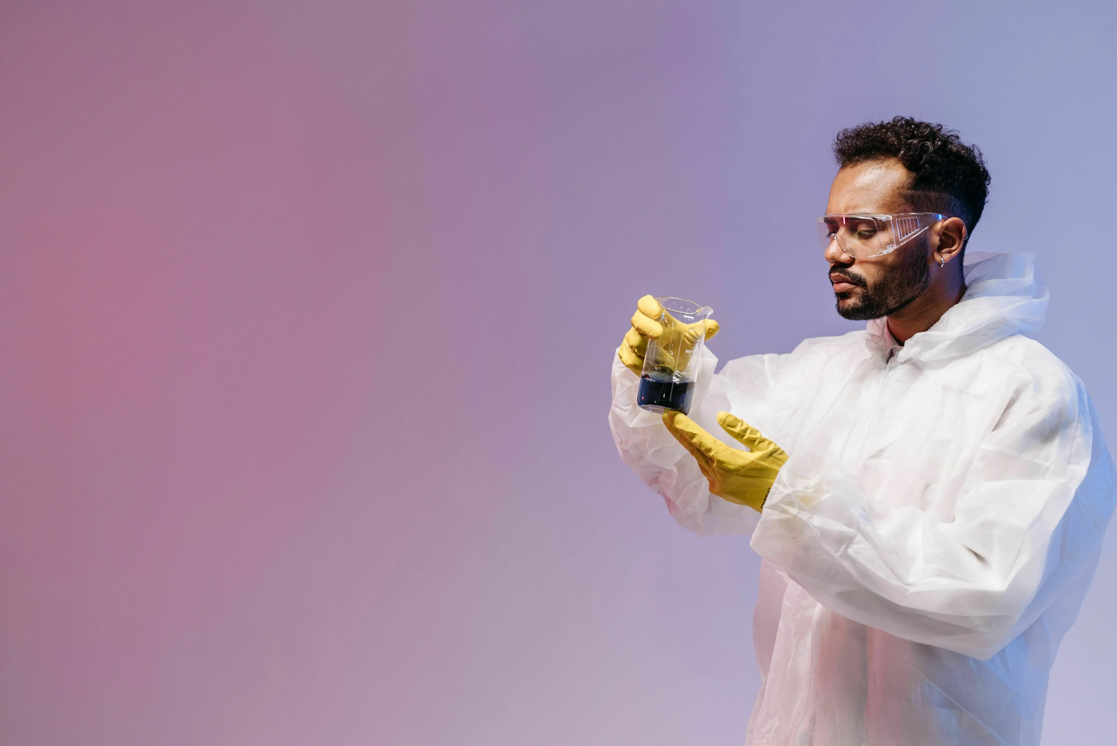 A scientist in a lab coat holding a beaker, illustrating a general knowledge pub quiz on vitamins.