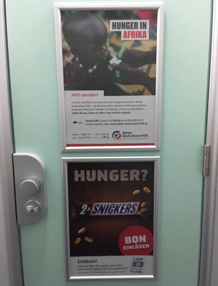 Hilarious placement of two ads about hunger, one serious and one for Snickers, making boring ads more interesting.