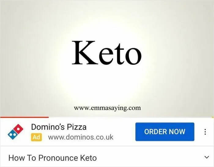 A boring ad for Domino's Pizza is placed ironically below a video titled 'How To Pronounce Keto'.