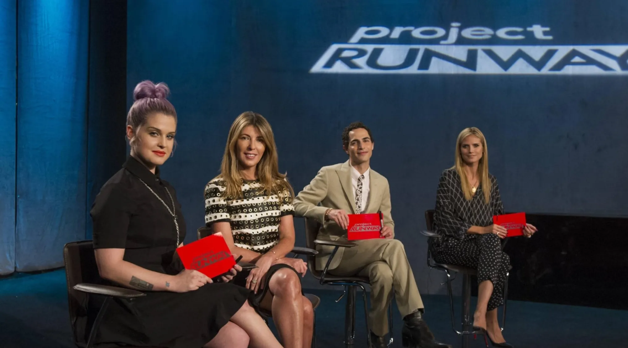 Project Runway judges Kelly Osbourne, Nina Garcia, Zac Posen, and Heidi Klum on a set. Reality TV shows.