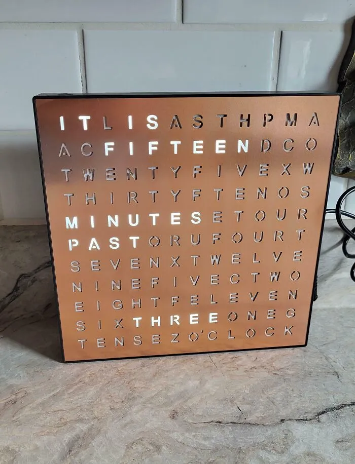 Copper word clock displaying time as words, a clever and stylish thrift store jackpot.