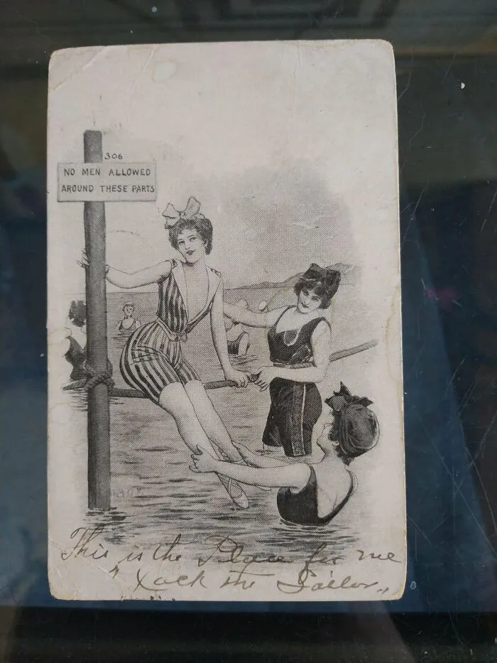 Black and white postcard of three women in old-fashioned swimsuits, illustrating how the past has changed.