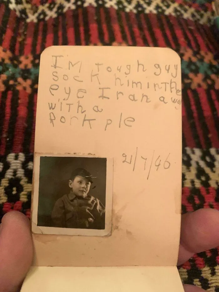 An old handwritten note with a photo of a boy, an example of fascinating ephemera.