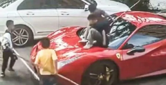 Kid Scratches Ferrari While Playing. Owner Sues The Family For 100k