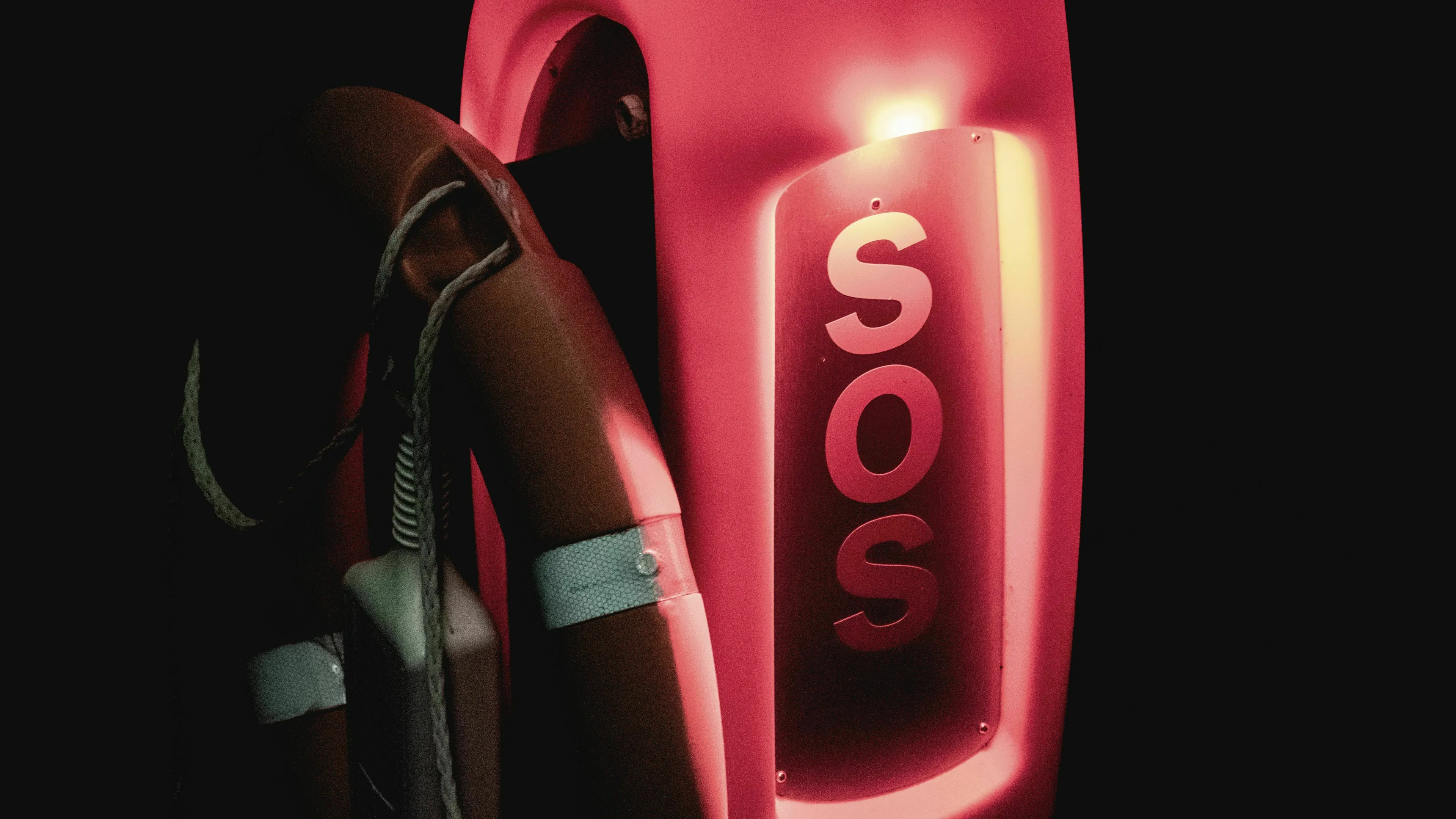 A red SOS sign next to a life preserver, representing forgetting something important and being a liar.