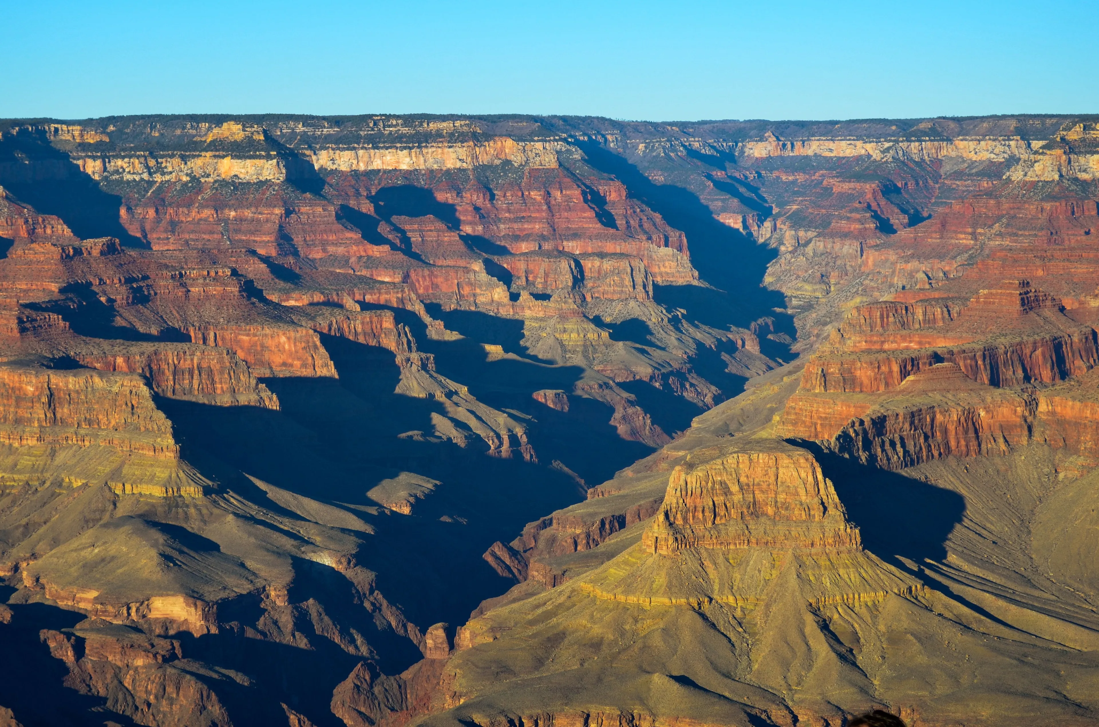 The Grand Canyon, vast and colorful, a landmark you'd exaggerate visiting.