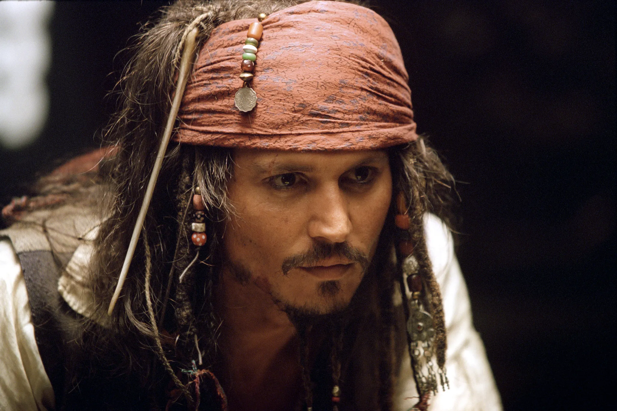 A fictional character, Jack Sparrow, from Pirates of the Caribbean, looks mischievous; his lying style is theatrical.