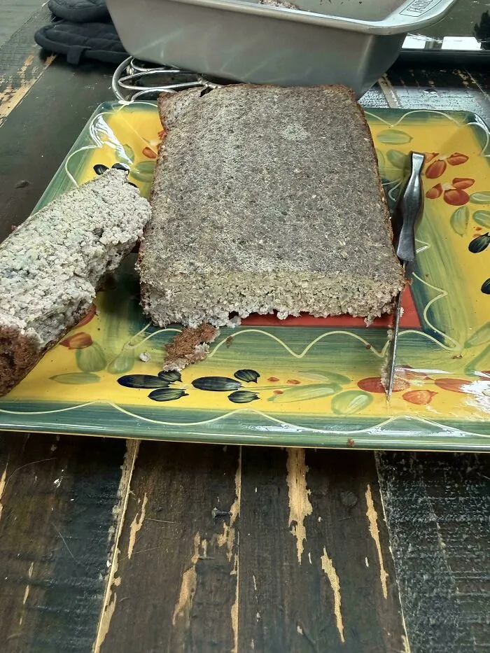 Sliced meatloaf-like loaf on a yellow floral tray showcasing questionable food combos.