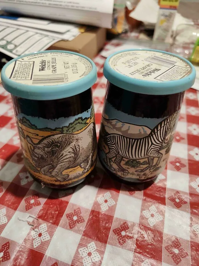 Two vintage Welch's grape jelly jars with animal designs, old products found at home.