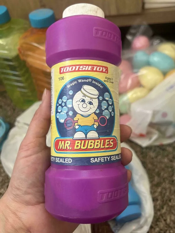 A purple bottle of Tootsietoy Mr. Bubbles, an old product found at home, proving some people never throw anything away.
