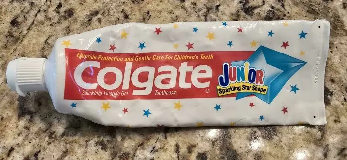 A tube of Colgate Junior toothpaste, an old product found at home that some people never throw away.