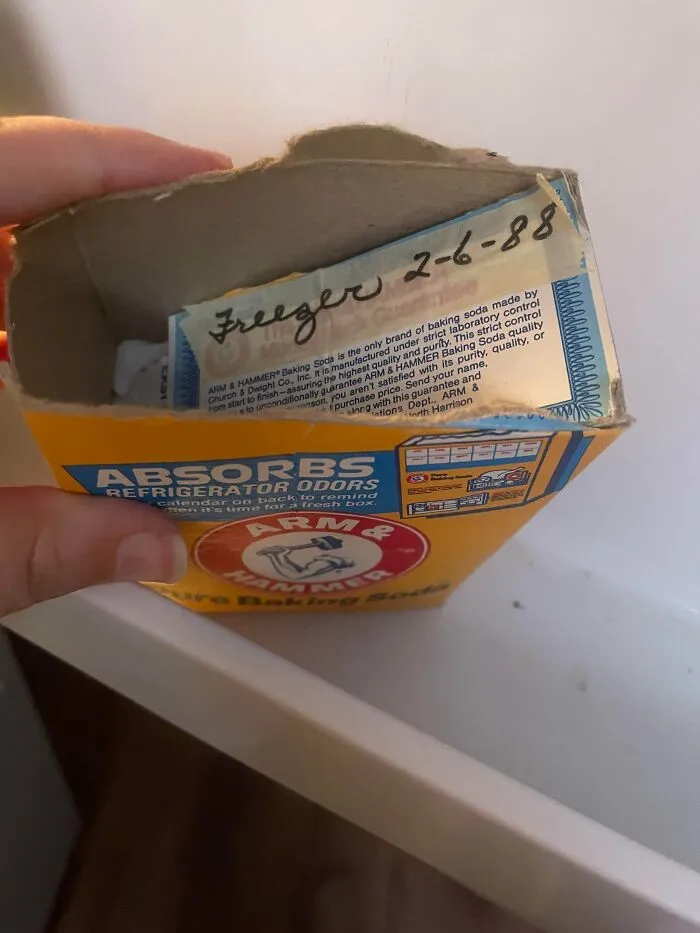 A box of Arm & Hammer baking soda with a handwritten date of 2-6-88, an old product found at home.