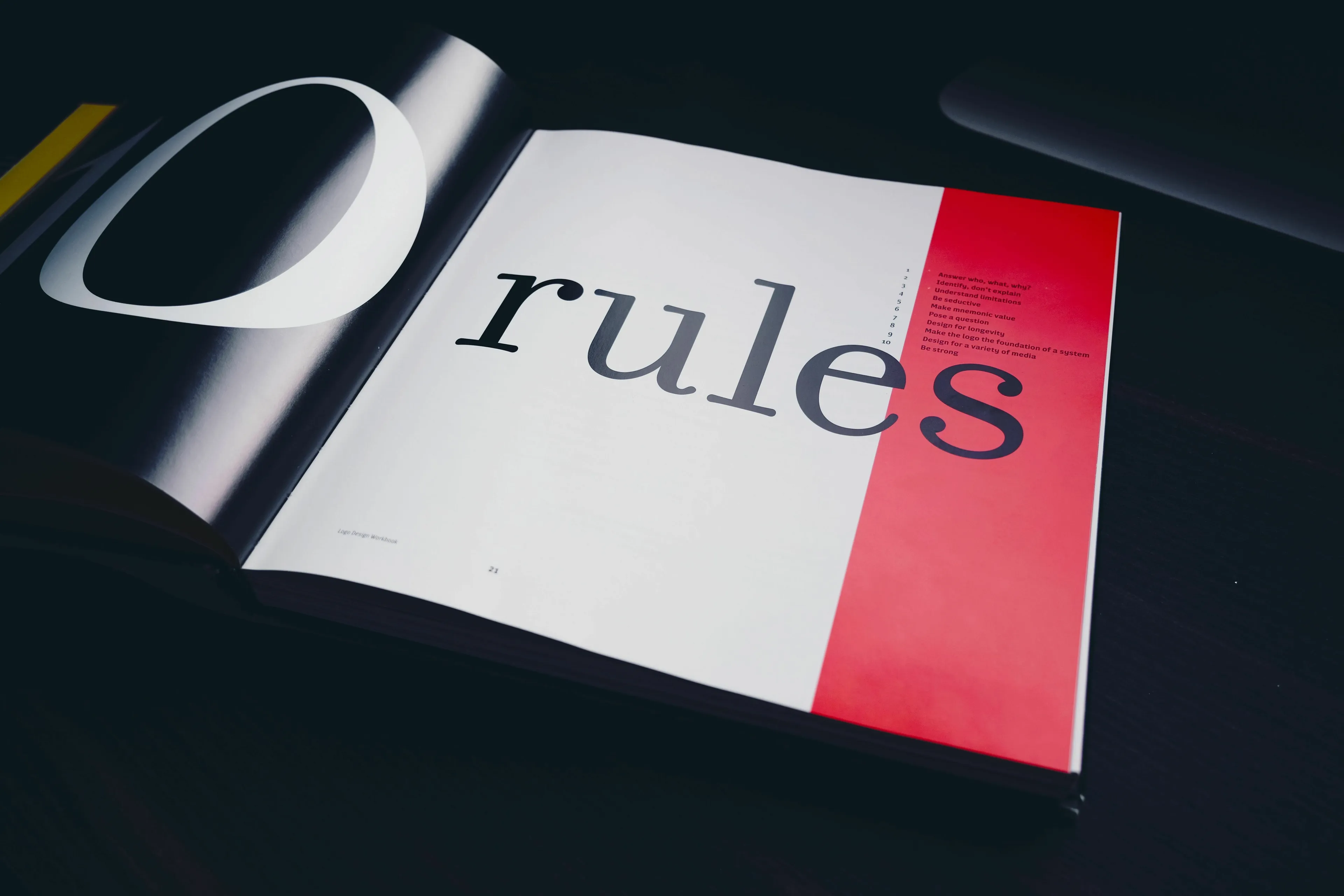 Open book displaying the word rules, representing ones relationship with rules in a utopia or dystopia.