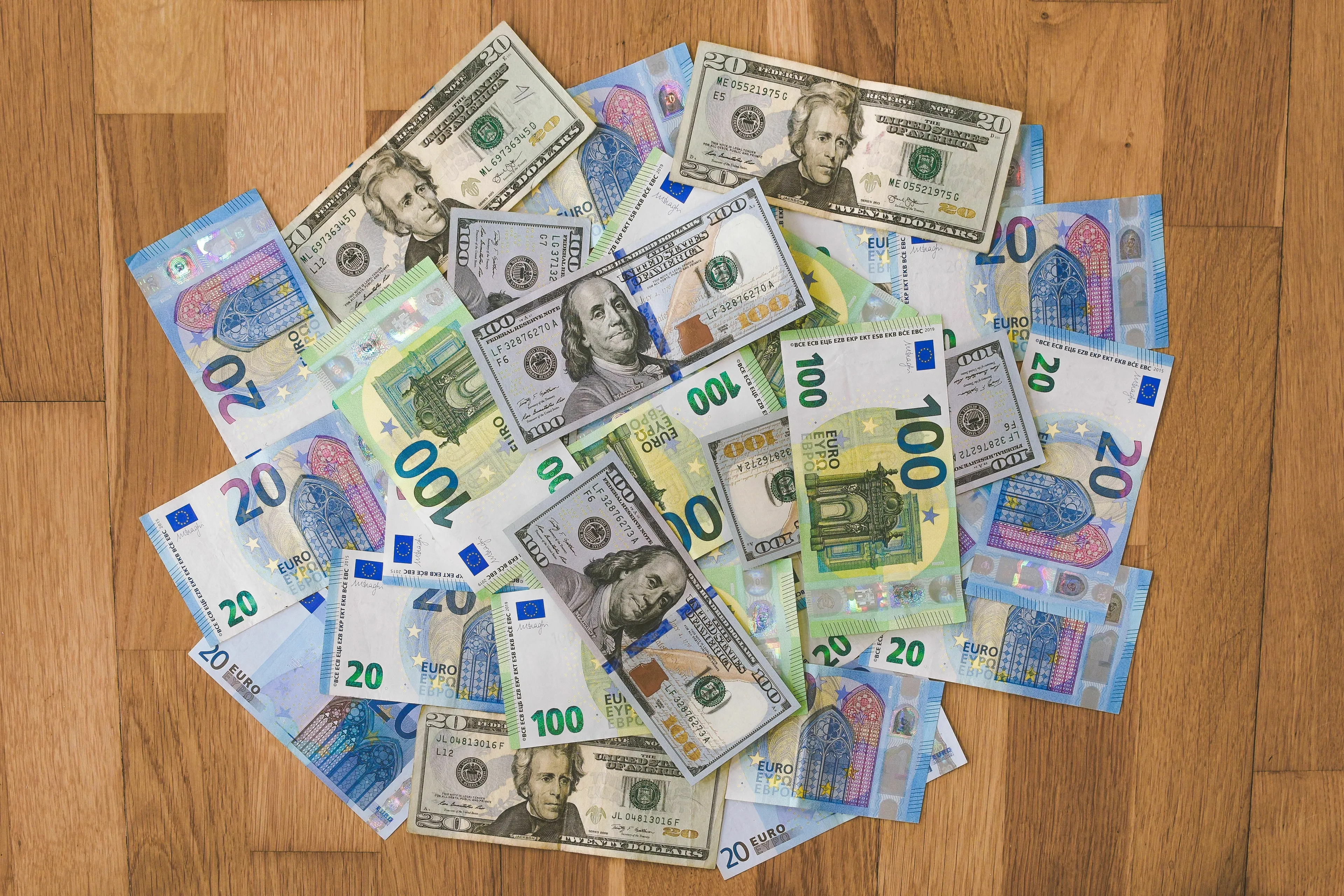 A pile of US dollar and Euro banknotes, representing money in a new world, a utopia or dystopia.