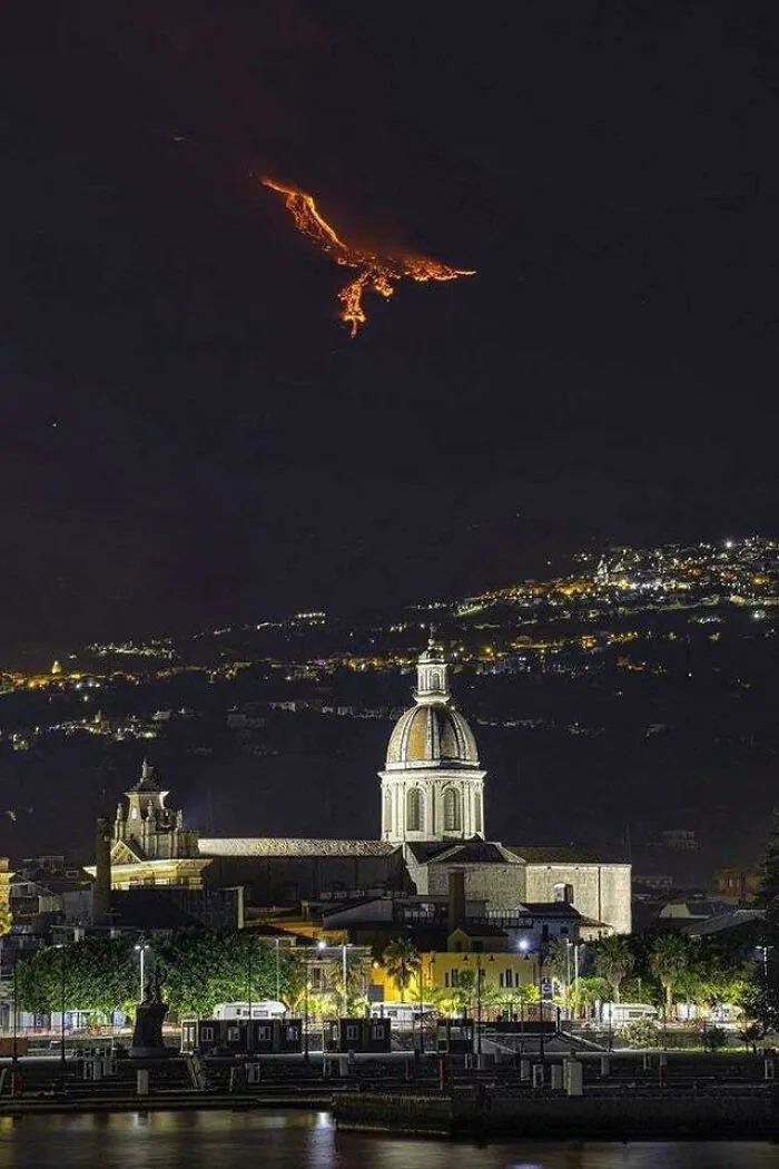 Eruption On Mount Etna (Sicily) Gives The Illusion Of A Phoenix In The Sky