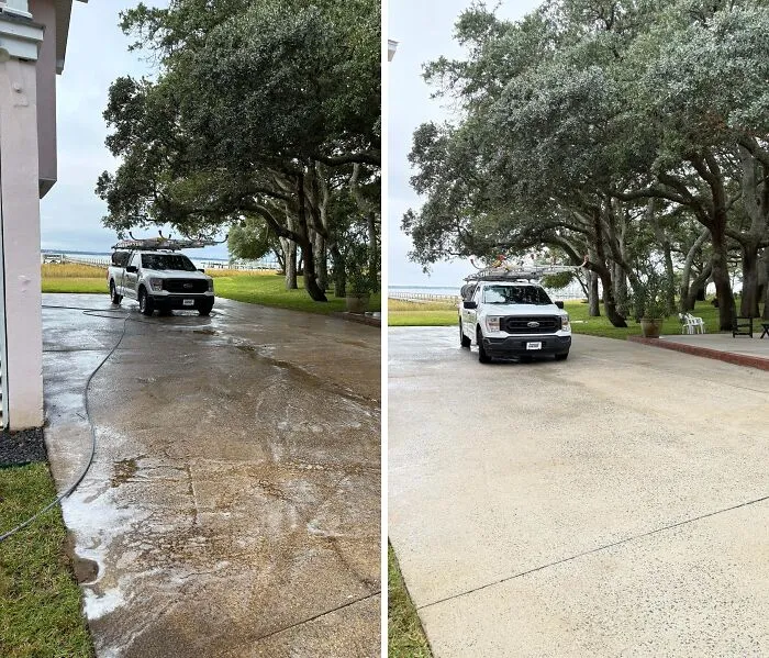 Satisfying power washing of a long, grimy driveway, showcasing a clean, bright transformation.