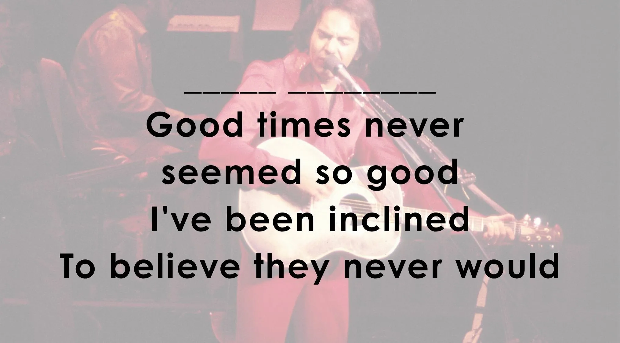 A person singing and playing guitar with song lyrics over the image. This image is for finish the song line.