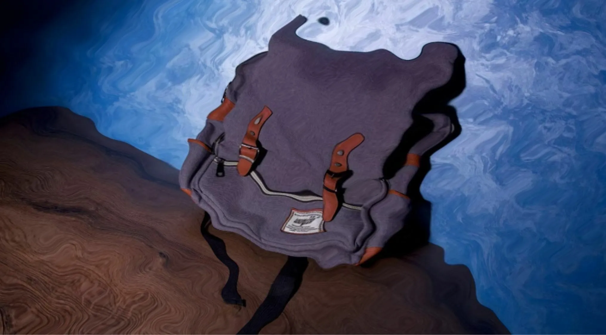 Distorted and glitched image of a backpack, guess the object.