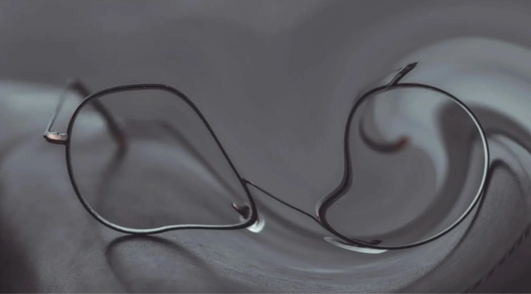 Distorted and glitched image showing eyeglasses, guess the object.