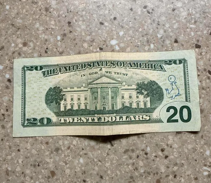20 Dollar Bill With Blue Seal Juggling A Ball On The Back