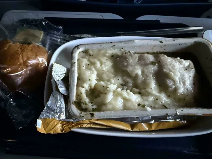 An unappetizing tray of mashed potatoes and mystery meat.