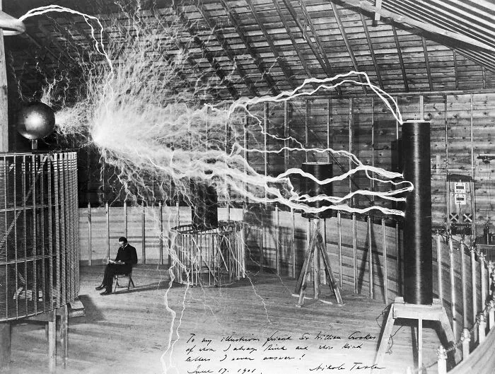Nikola Tesla Appears To Read Beneath 22-Foot Electrical Arcs In This Deliberately Staged 1899 Double Exposure